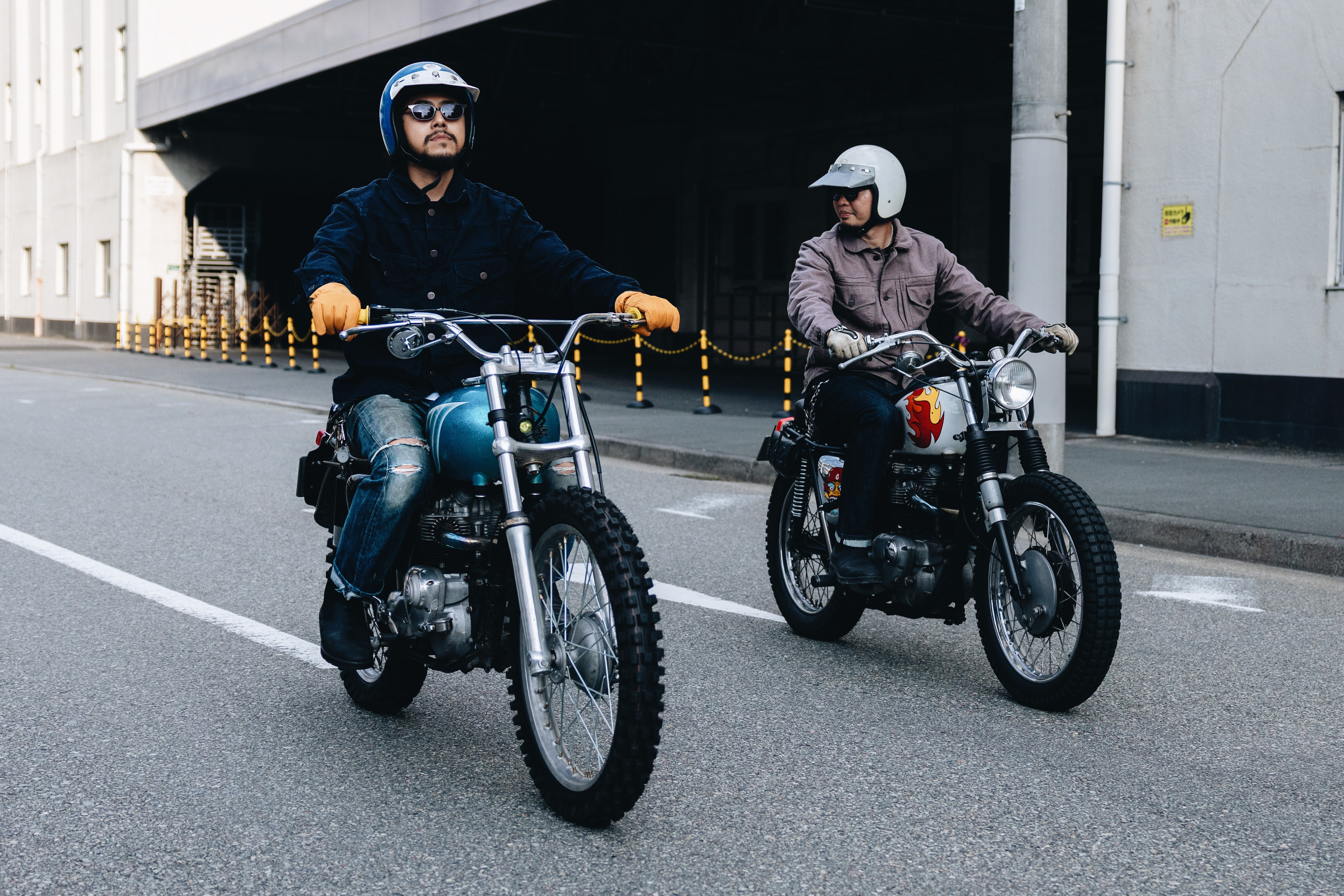 Jackets - Two men riding motorbikes wearing Triumph Heritage Jackets