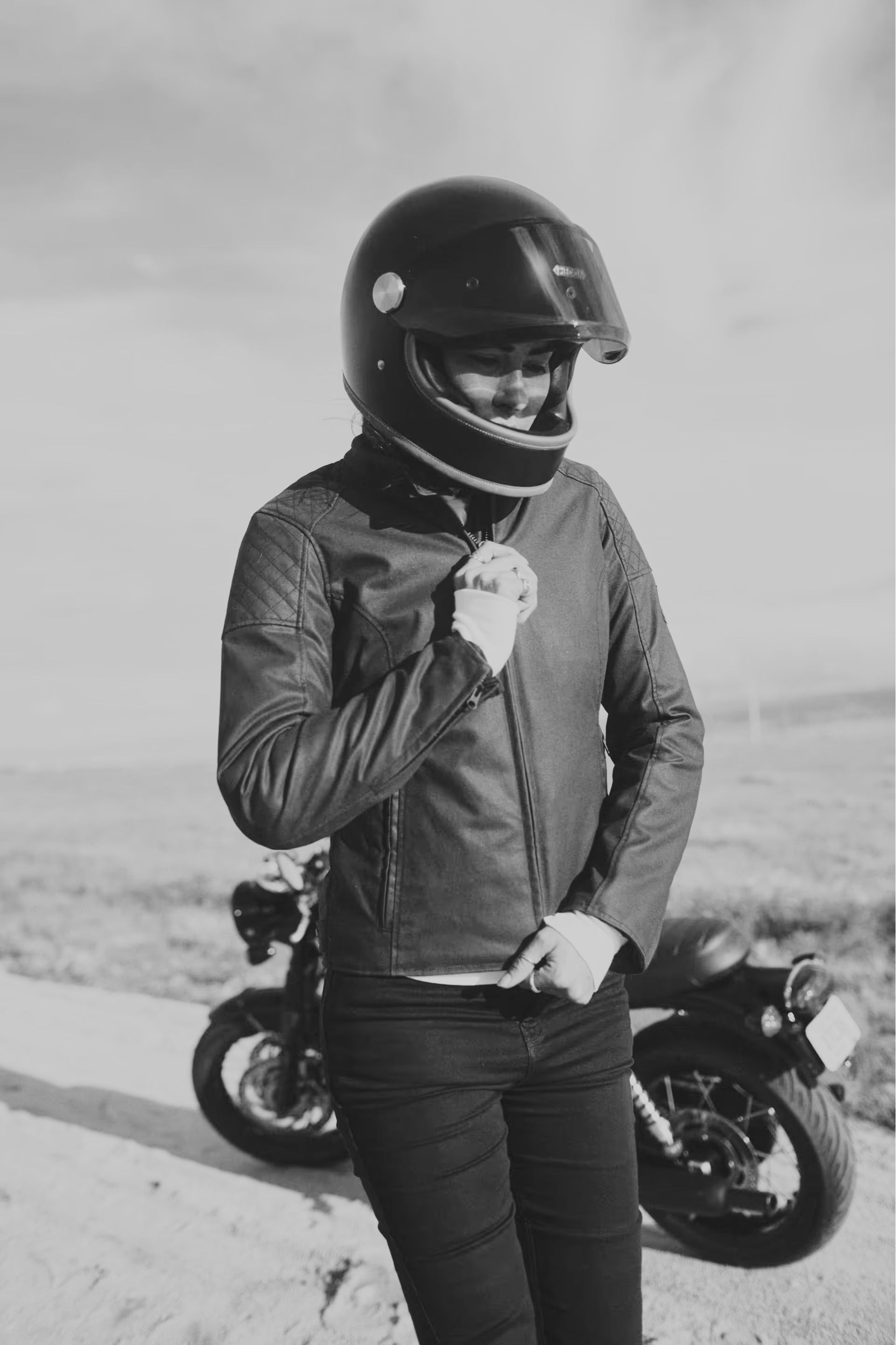 Woman zipping up her triumph braddan jacket