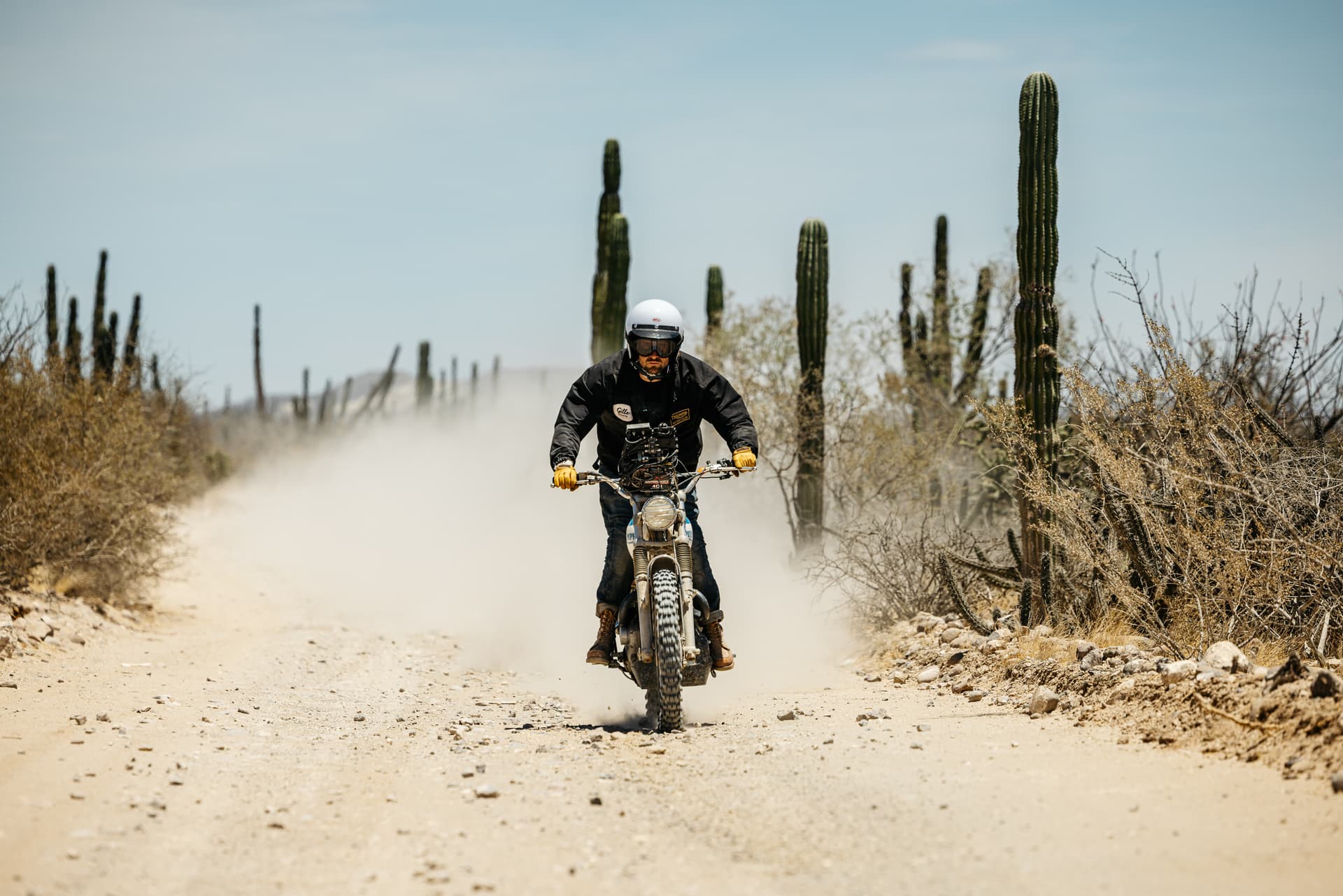 Three men on bikes wearing Triumph Heritage clothing